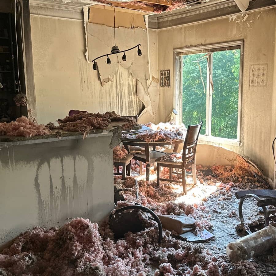 house with damaged interior with insulation on everything