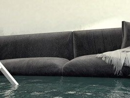 photo illustration of couch, chair and houseplant floating in deep water inside a hosue