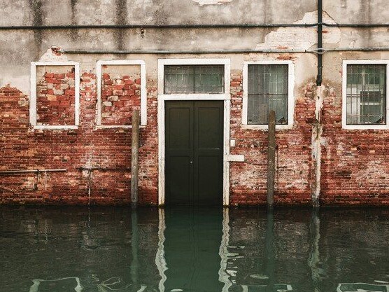 flooding to the door of a brick building
