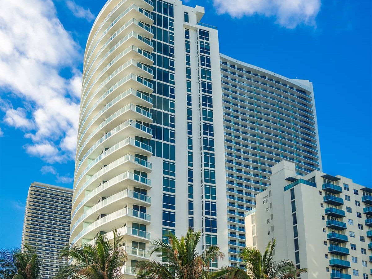 hotel high rise with palm trees