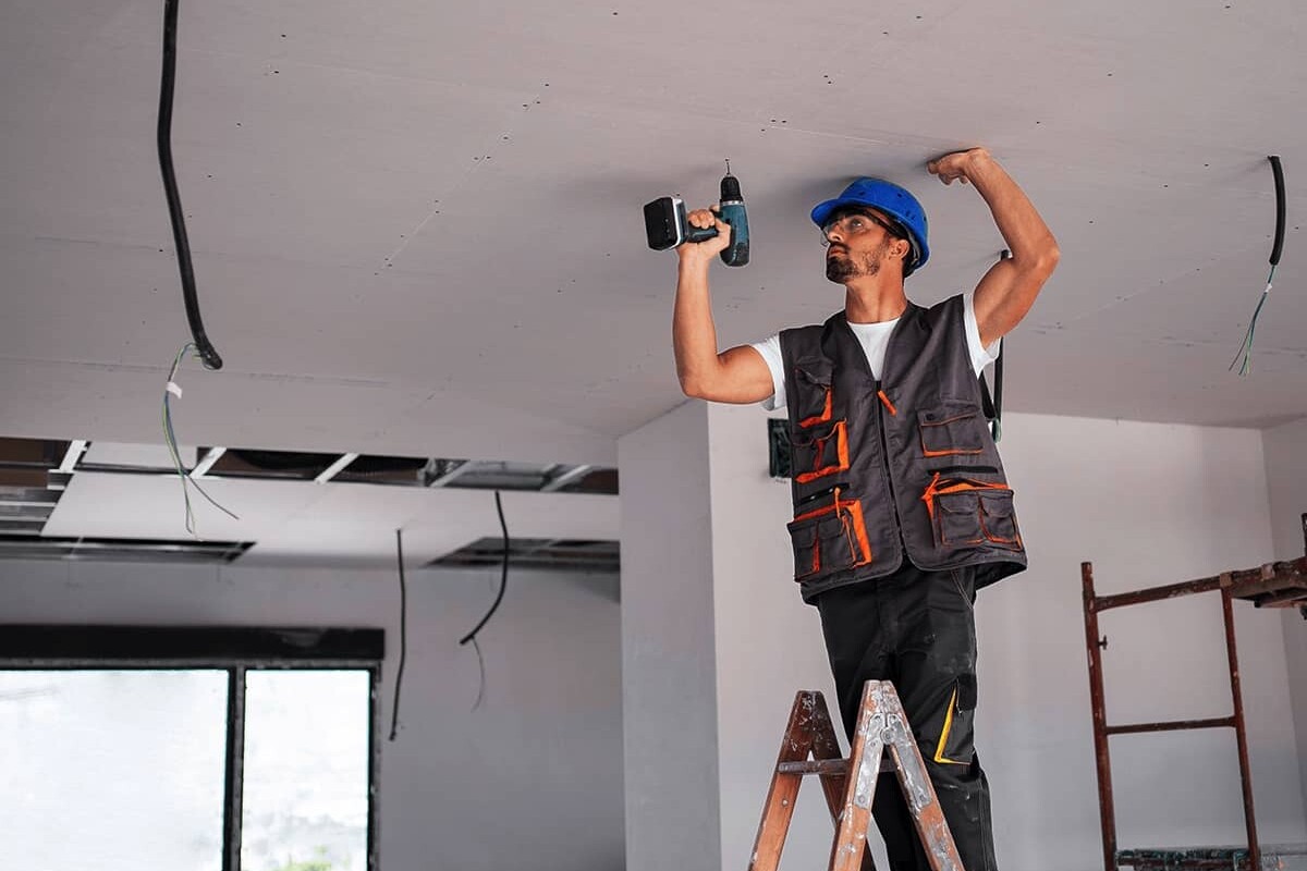 man standing on ladder